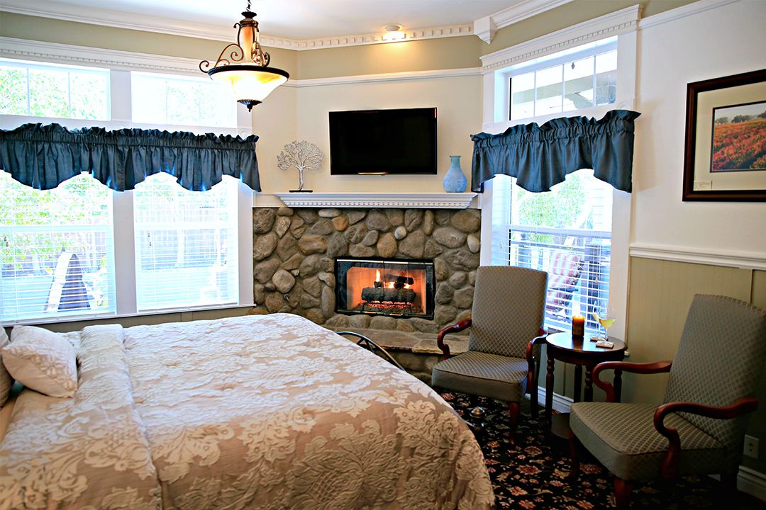 Tons of Natural Light and A River Rock Fireplace In Our Tercero Room