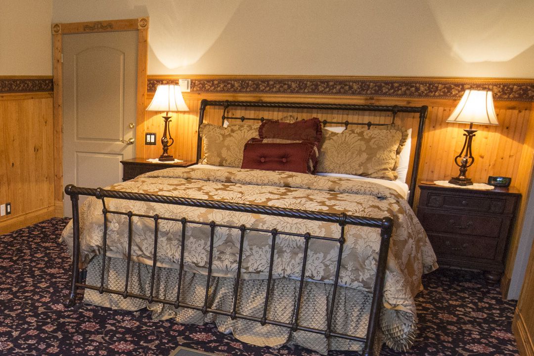 A Super Comfortable Wrought Iron Bed Awaits You in Our Artiste Suite
